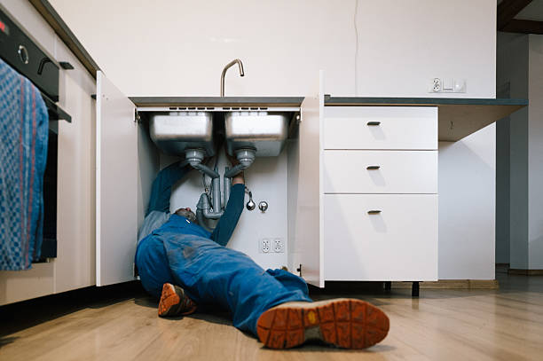 Professional Emergency Plumber technician working in Washington Grove, MD